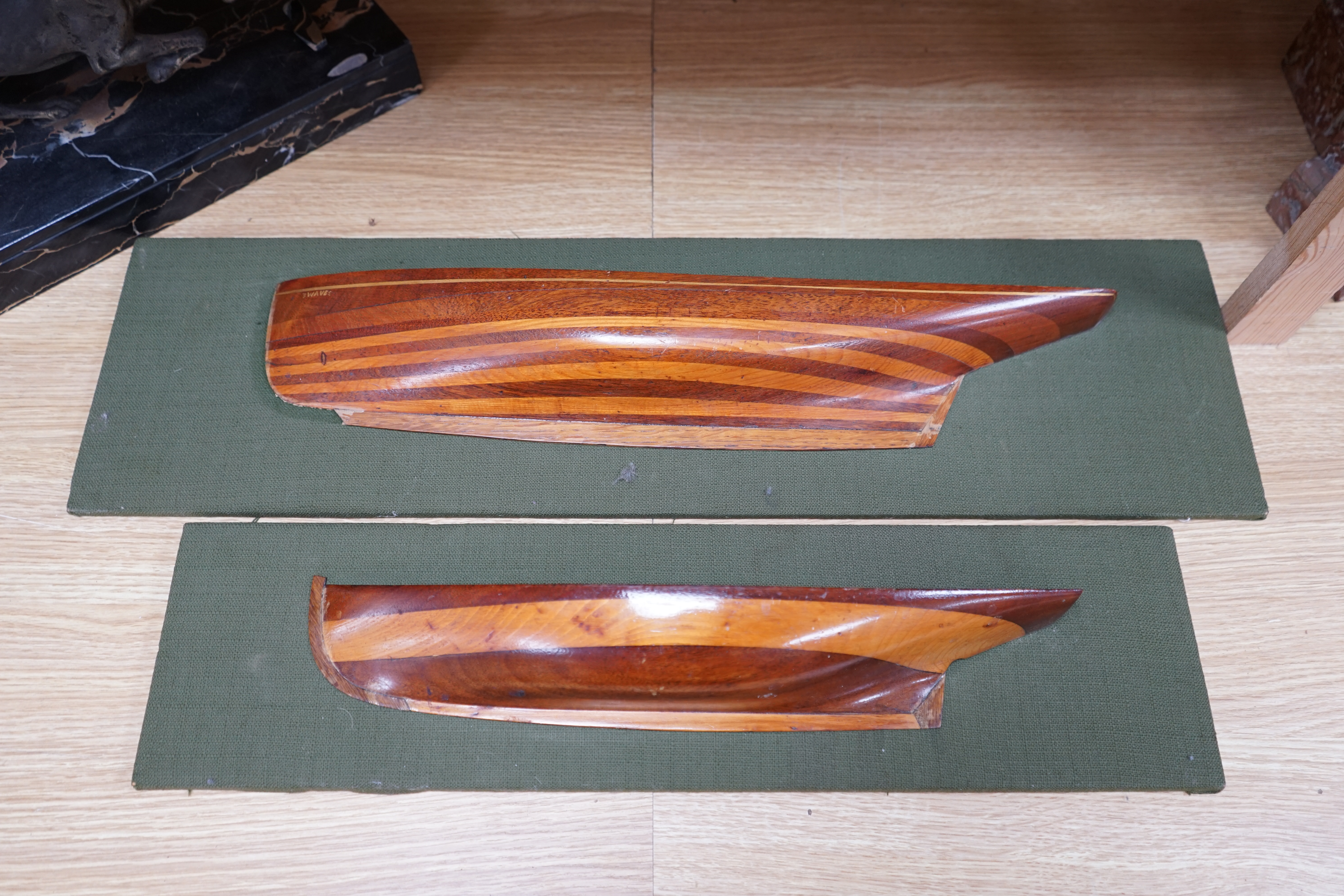 Two mounted cross banded mahogany and yew wood split hull models. Condition - fair to good